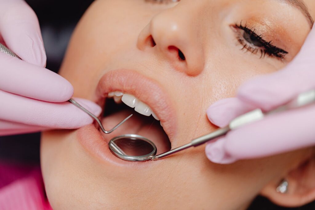pexels-photo-6627536 Close-Up Photo of a Woman Getting a Dental Check-Up